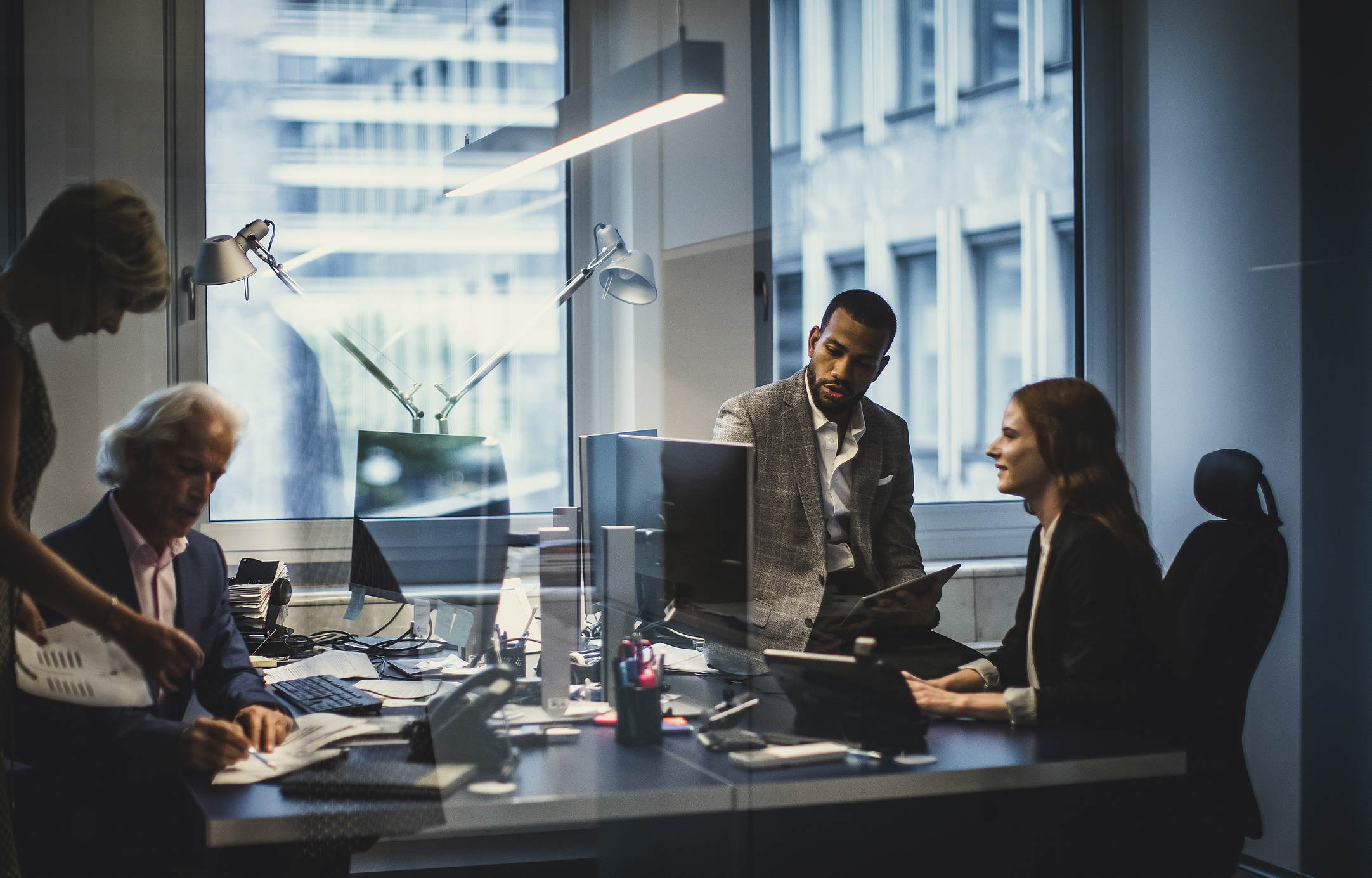 A group of businesspeople working in an office.
