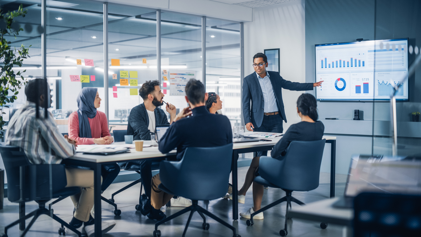 A Marketing Manager Leads a Team Meeting in a Conference Room..jpg