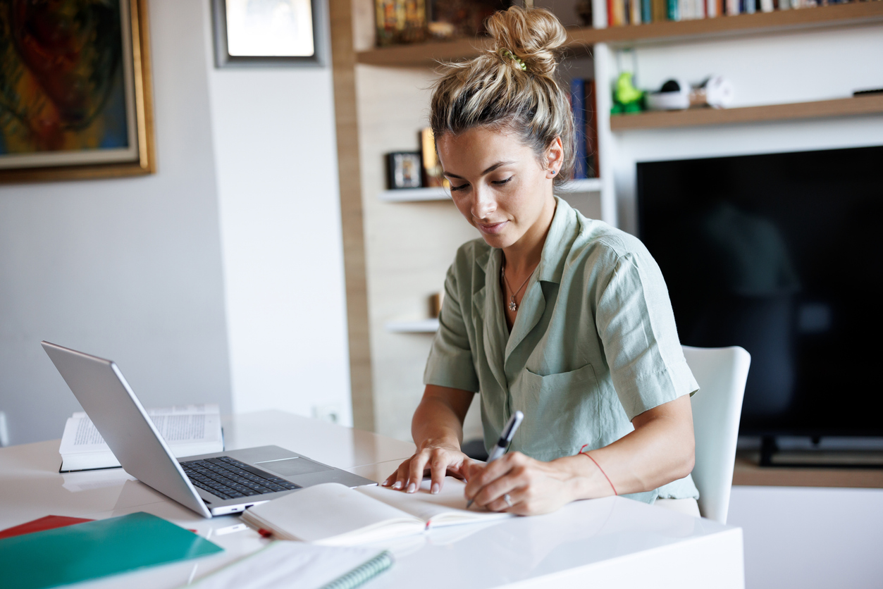 An MBA student working on a laptop.